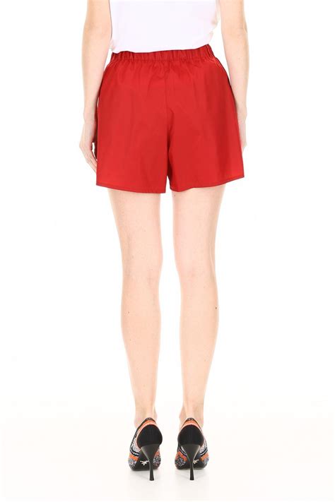 prada shorts red badge